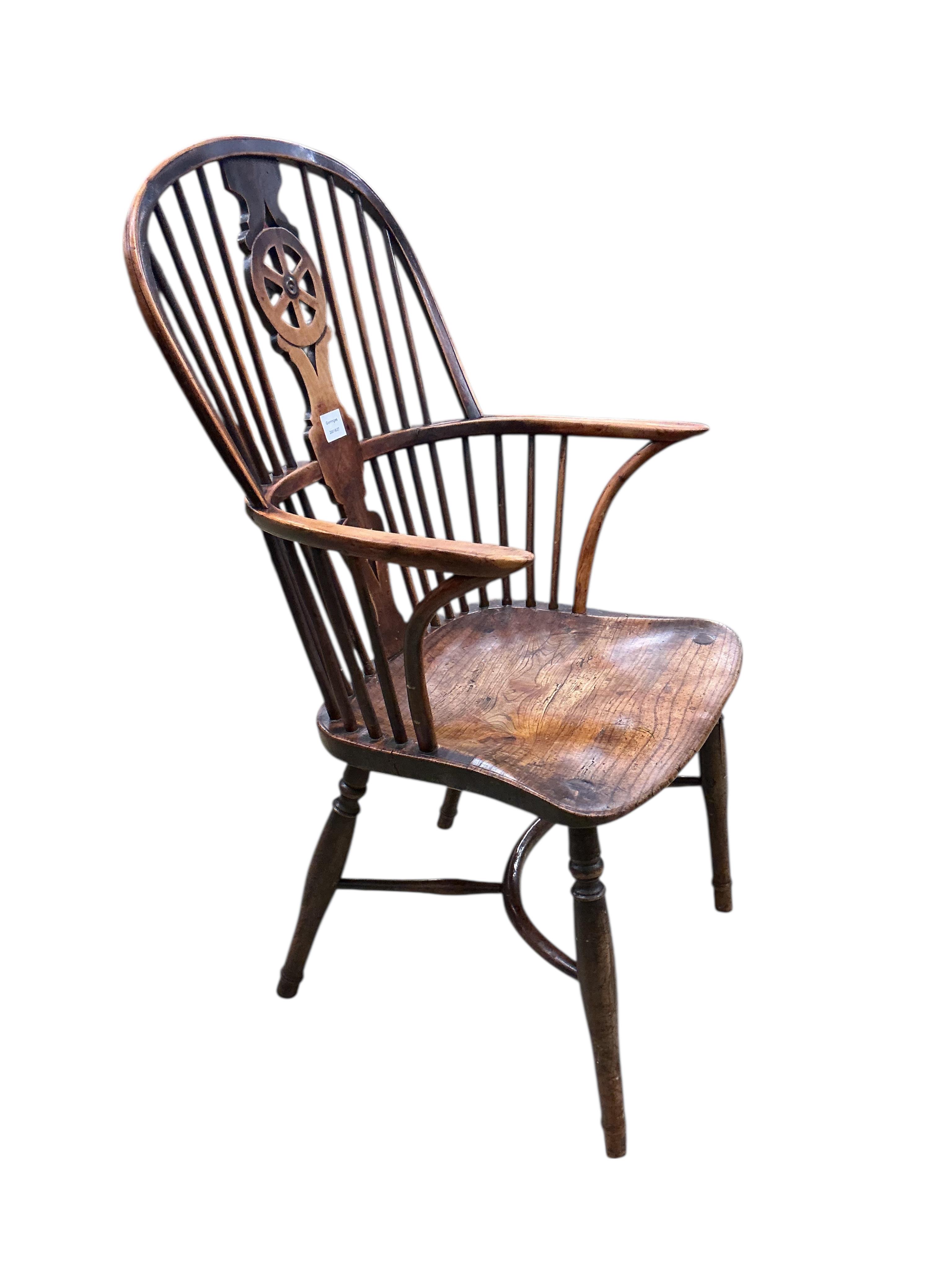 A 19th century yew and elm Windsor wheelback armchair with crinoline stretcher, width 58cm, depth 42cm, height 100cm
